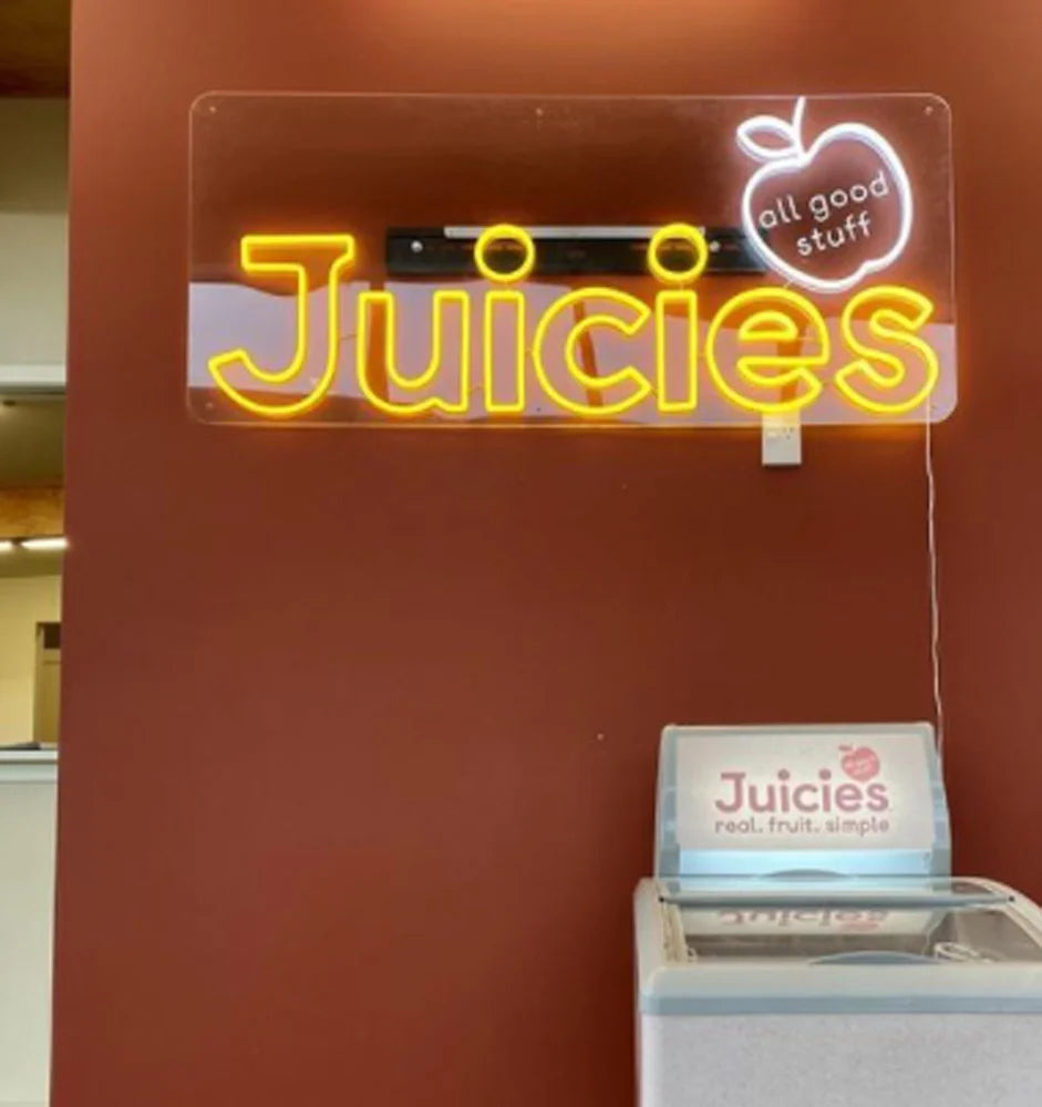 Logo Juicies reproduit en enseigne néon