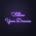 Néon LED Follow Your Dreams allumé sur mur sombre