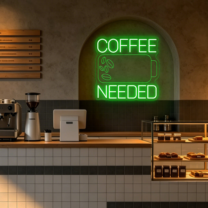 Enseigne néon LED Coffee Needed verte dans un café